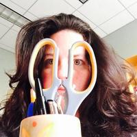 Kendrai Meeks Author peering thought scissor handles